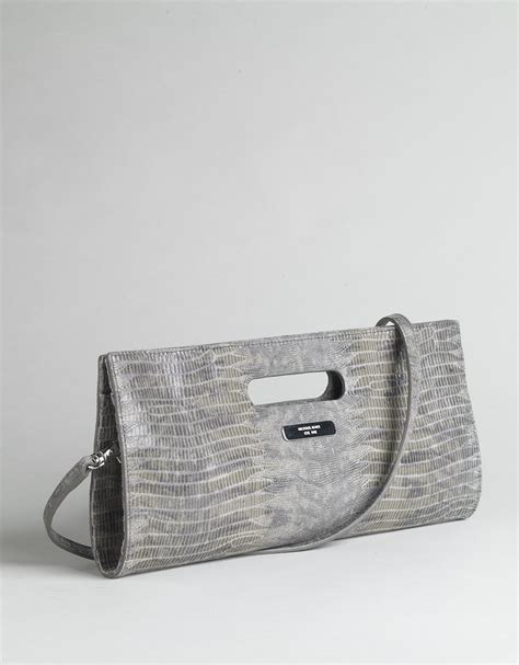 does michael kors use fake snake skin kcutch|are michael kors bags genuine.